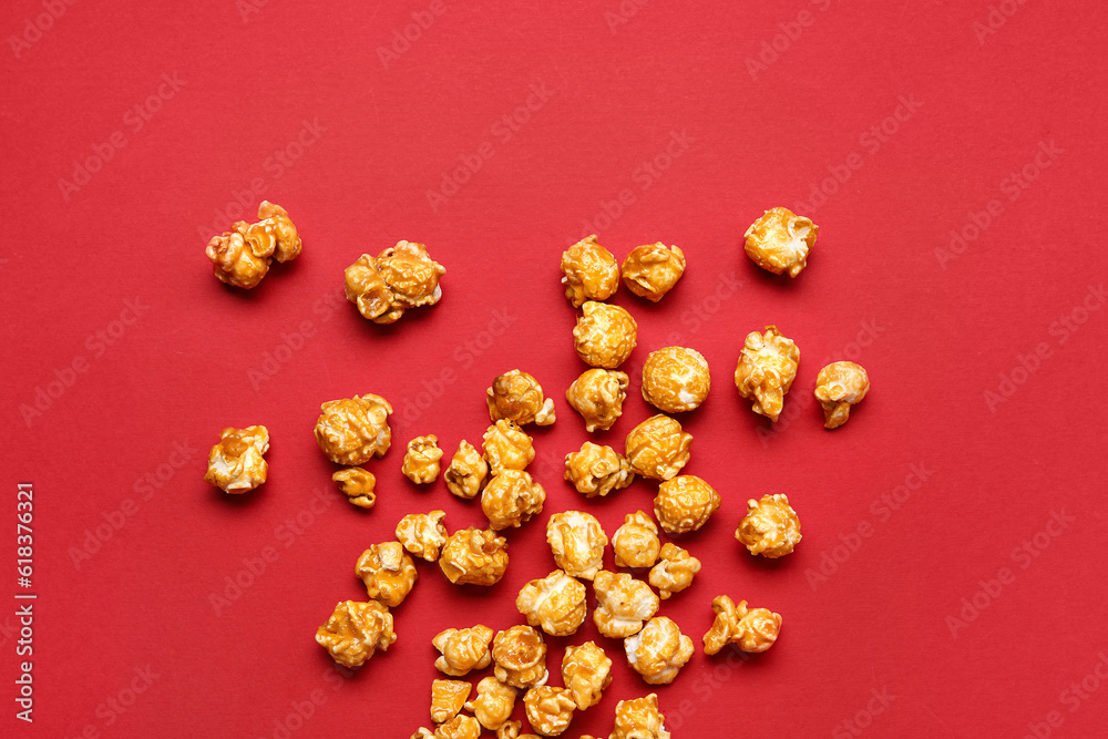 Tasty popcorn on red background