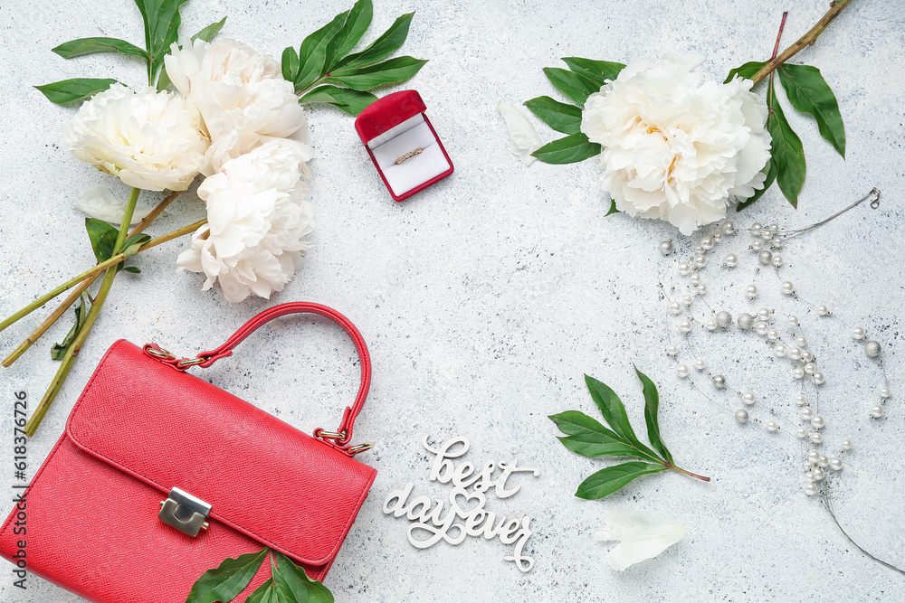 Frame made of stylish female accessories and beautiful peony flowers on light background