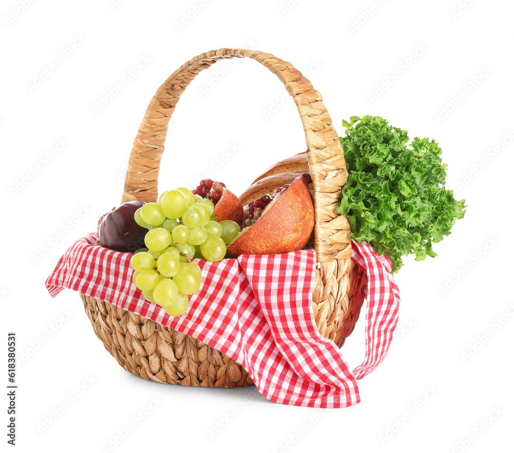 Wicker basket with delicious food for picnic on white background