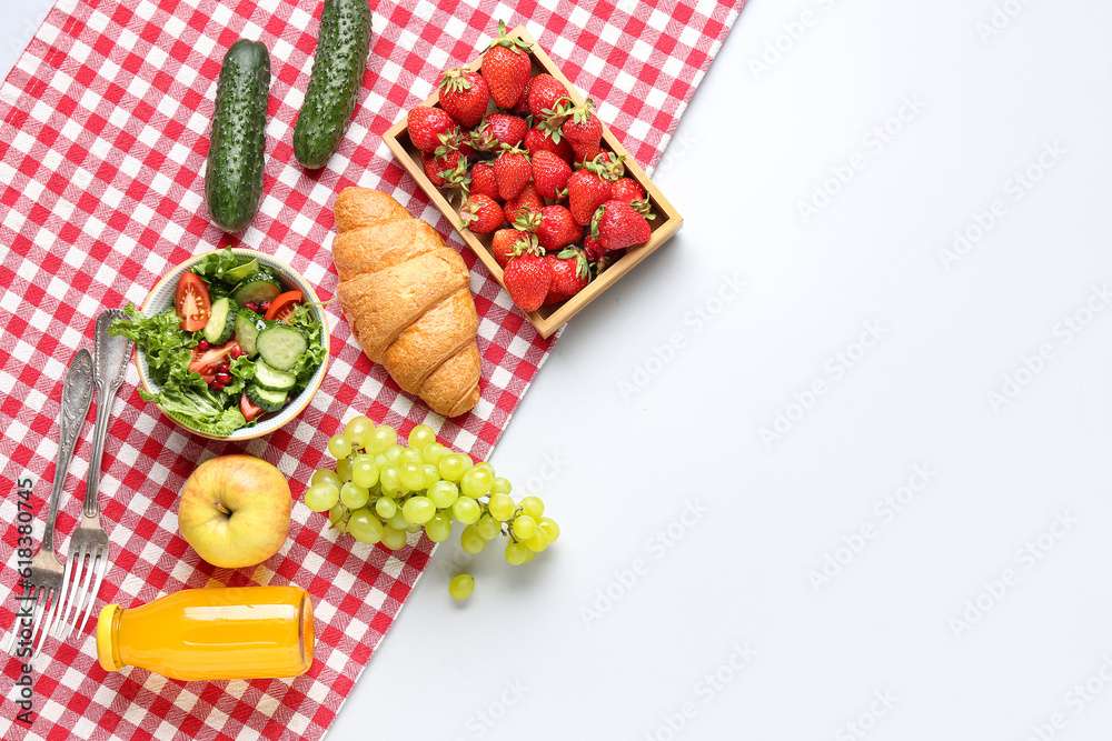 Bowl with salad, tasty food and juice for picnic on white background