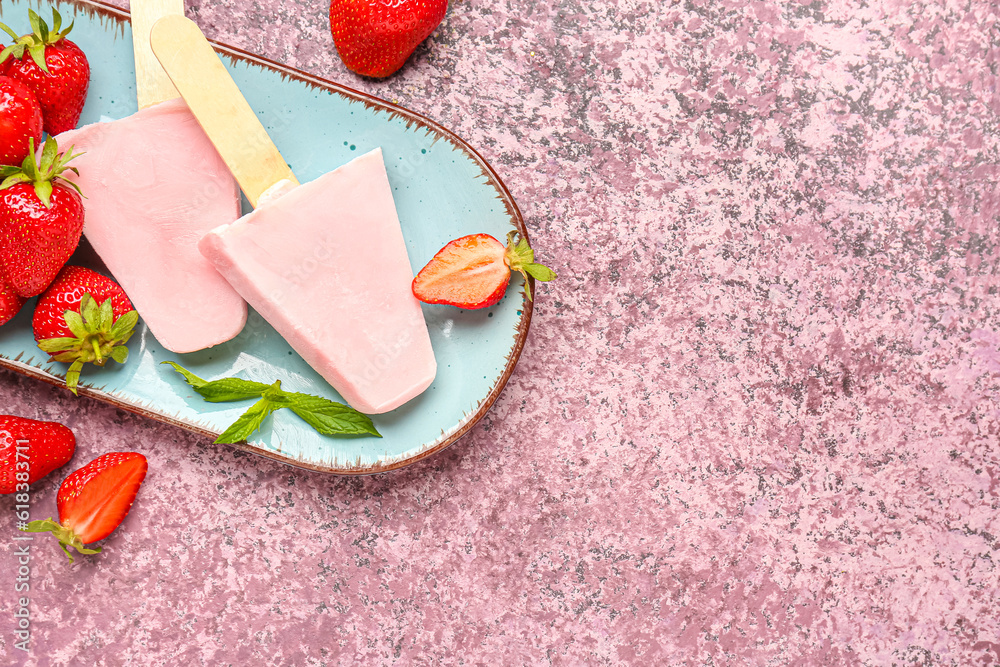 Plate with sweet strawberry ice-cream popsicles on purple background