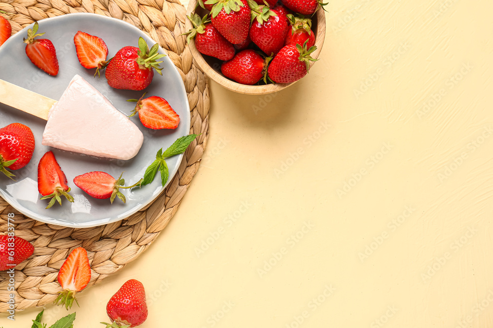 Plate with sweet strawberry ice-cream popsicle and bowl of berries on yellow background