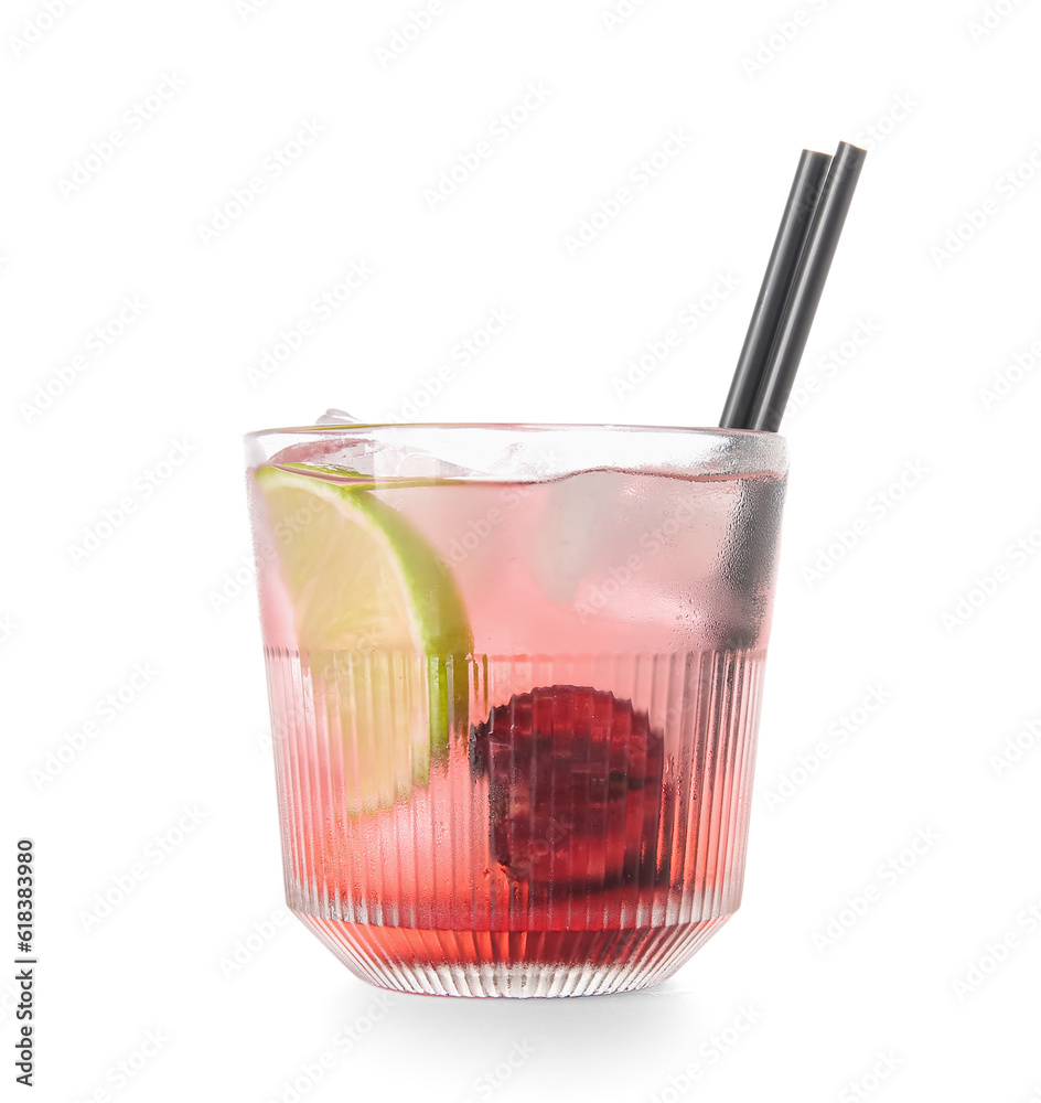 Glass of tasty cherry lemonade with lime on white background