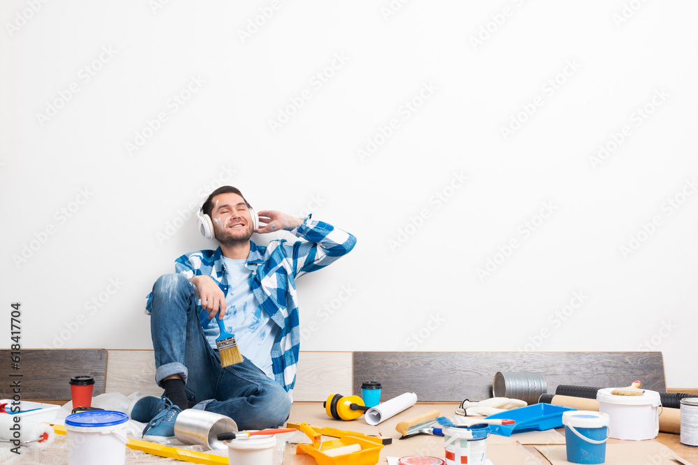 Bearded man listening to music in headphones