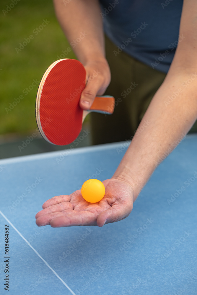 table tennis player doing a serve, close-up, The concept of sport and healthy lifestyle.