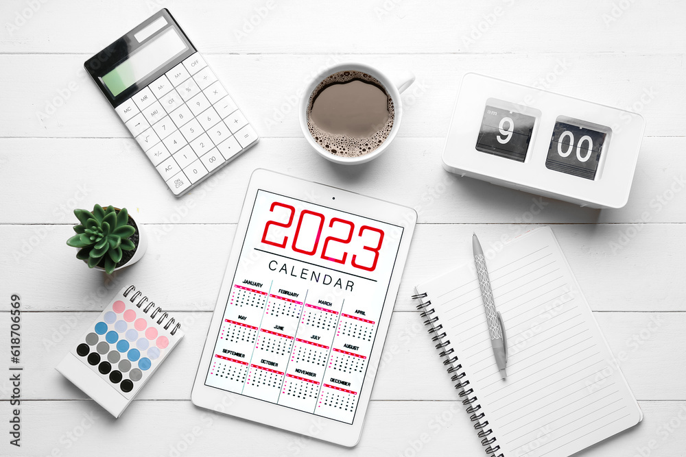 Composition with calendar, cup of coffee, clock and calculator on white wooden background