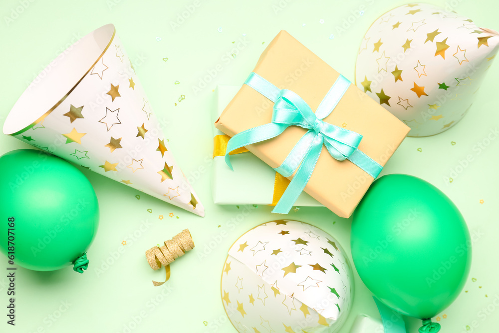 Different party decor on pale green background