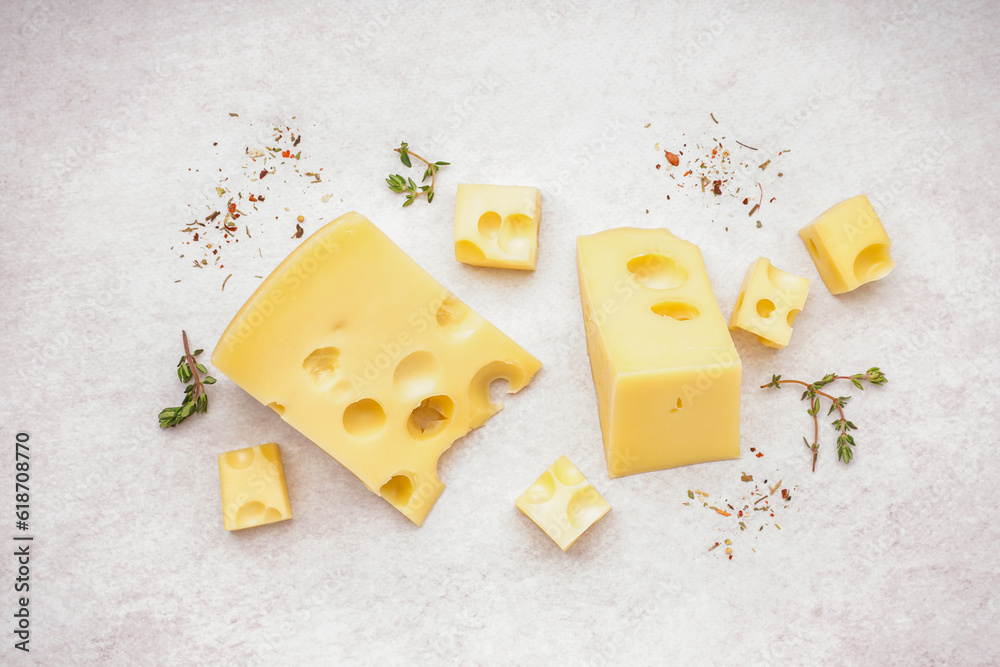 Pieces of Swiss cheese on white background