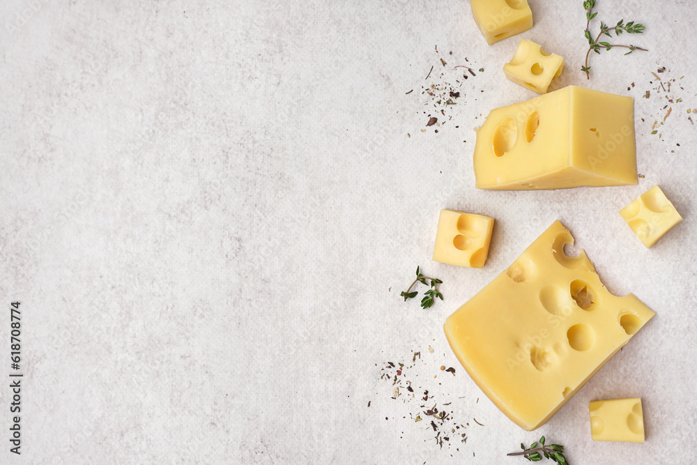 Pieces of Swiss cheese on white background