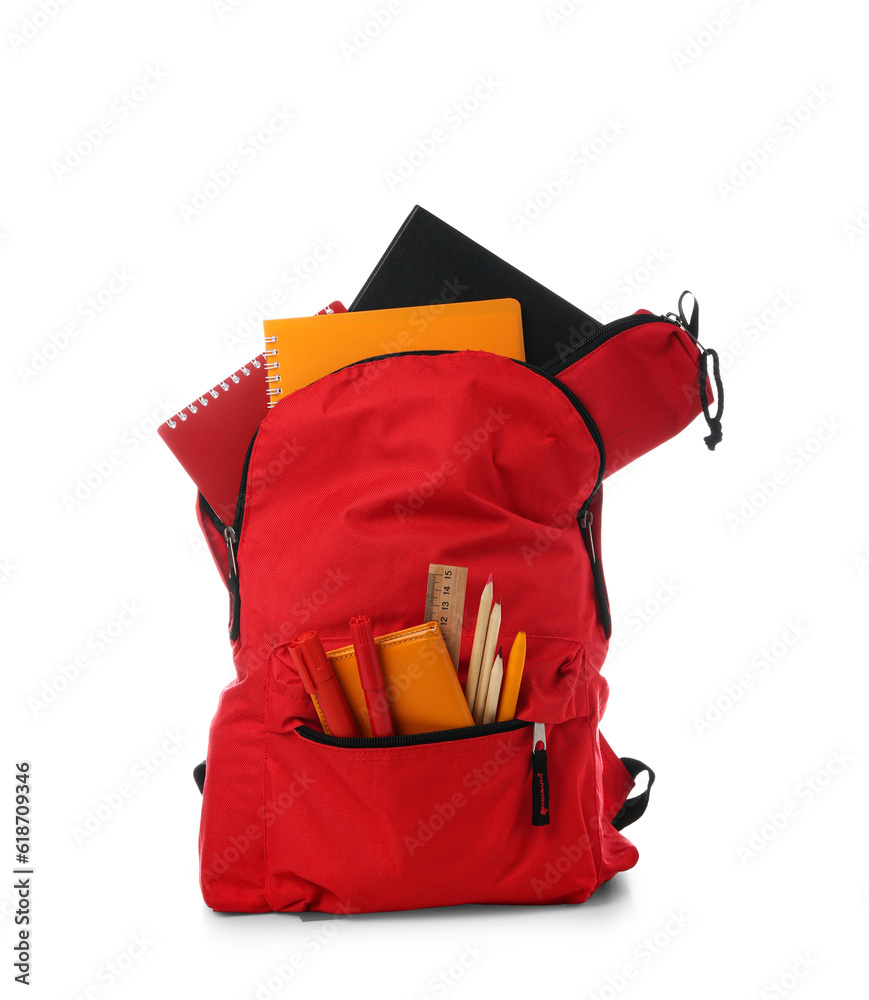 Red school backpack with notebooks, pencil case and markers on white background