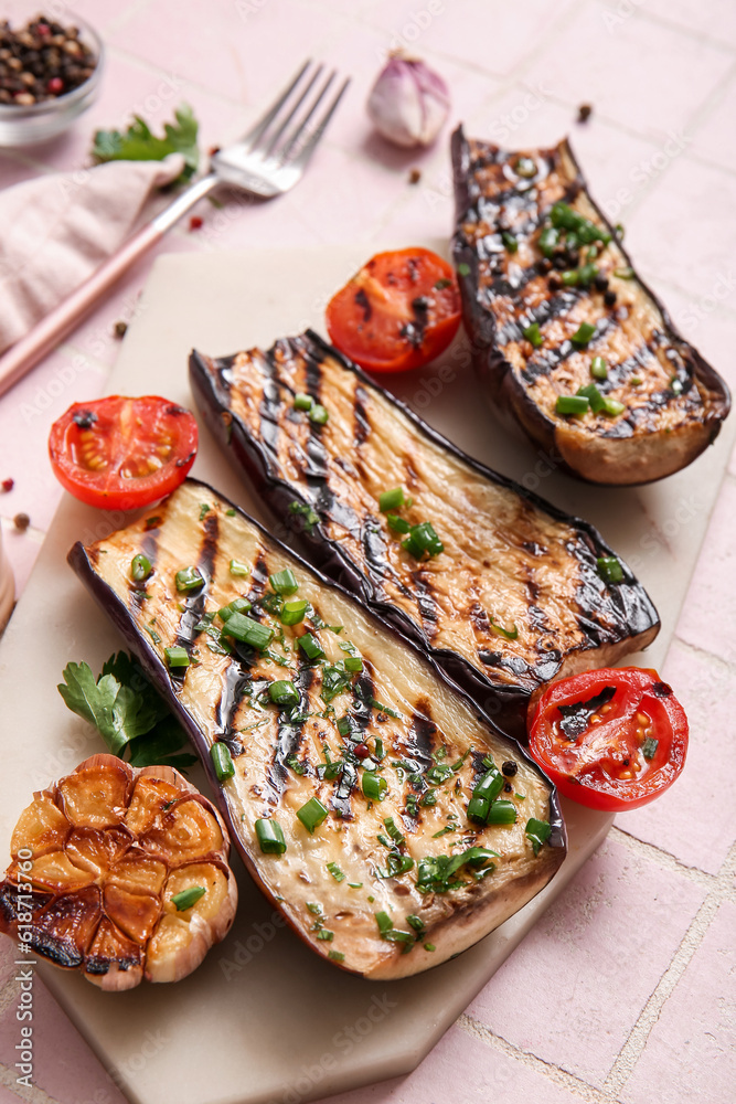 Delicious grilled eggplants, tomatoes and spices on light background