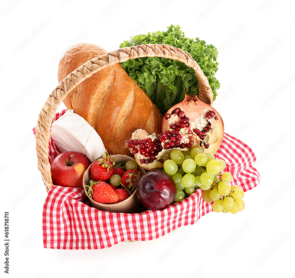 Wicker basket with delicious food for picnic on white background