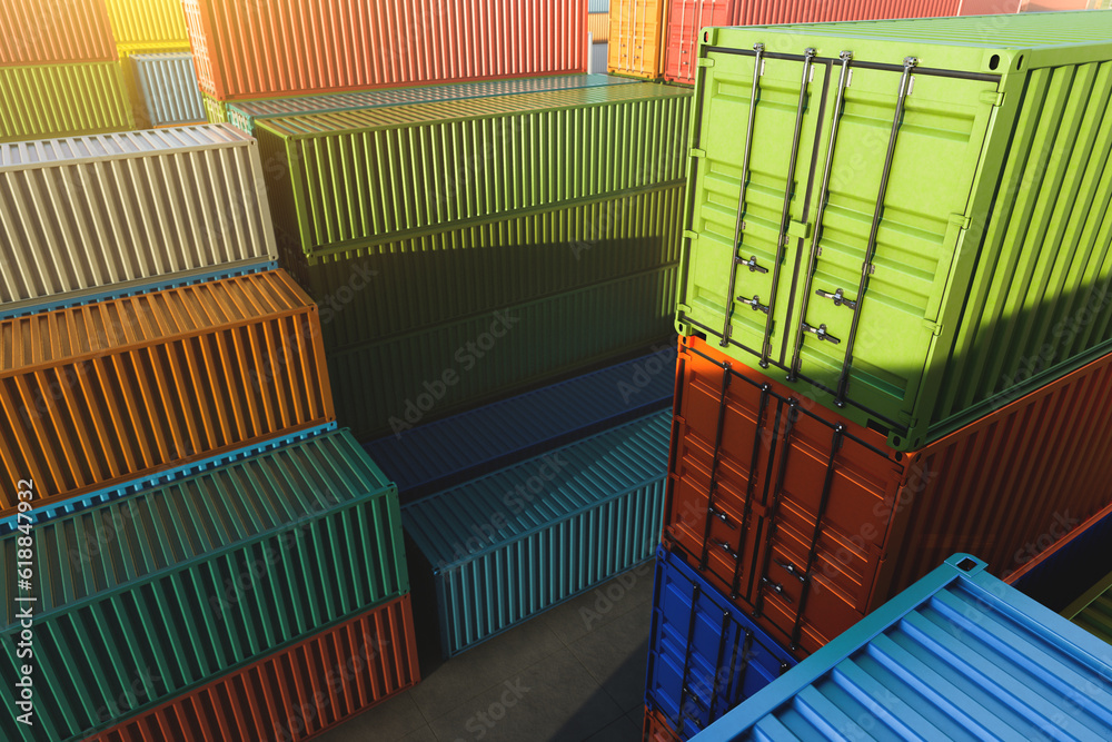 Cargo containers of different colors in the fog, at sunset