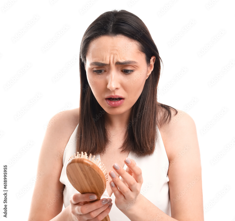 Worried young woman with hair loss problem on white  background