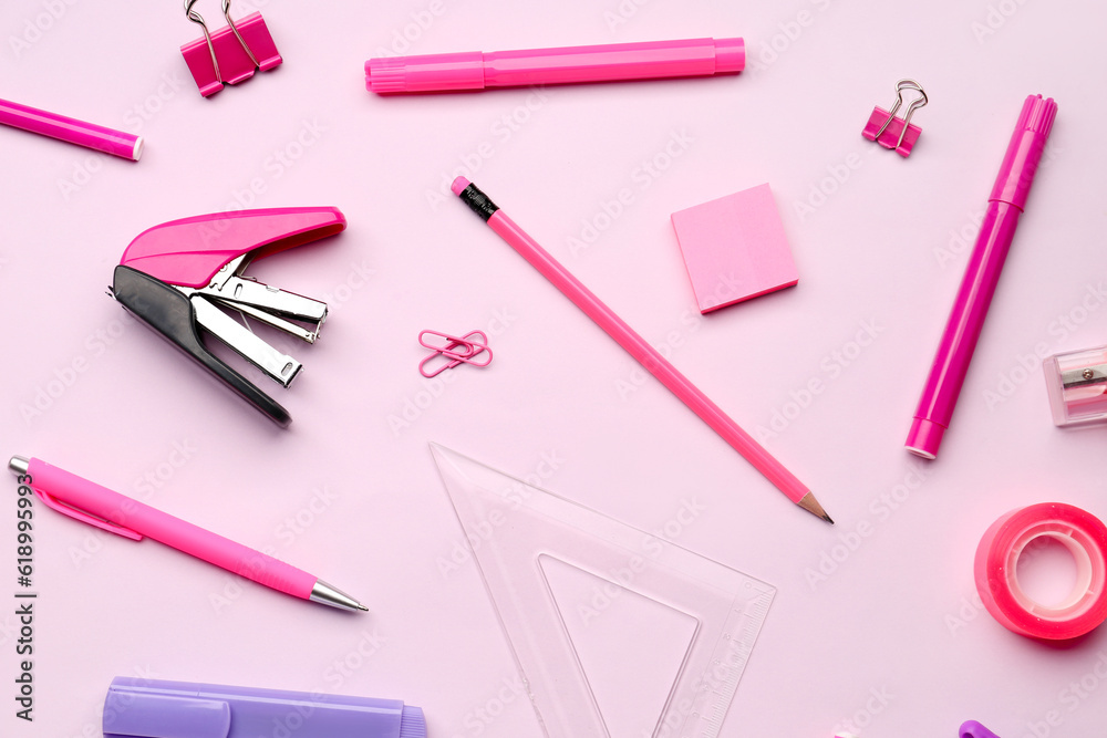 Composition with stationery supplies on pink background