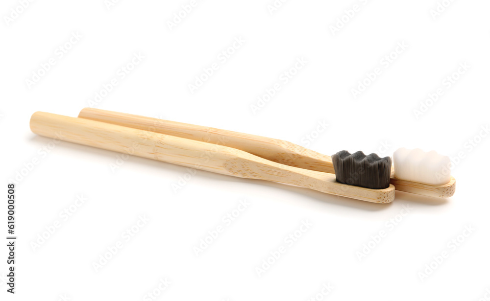 Bamboo tooth brushes on white background