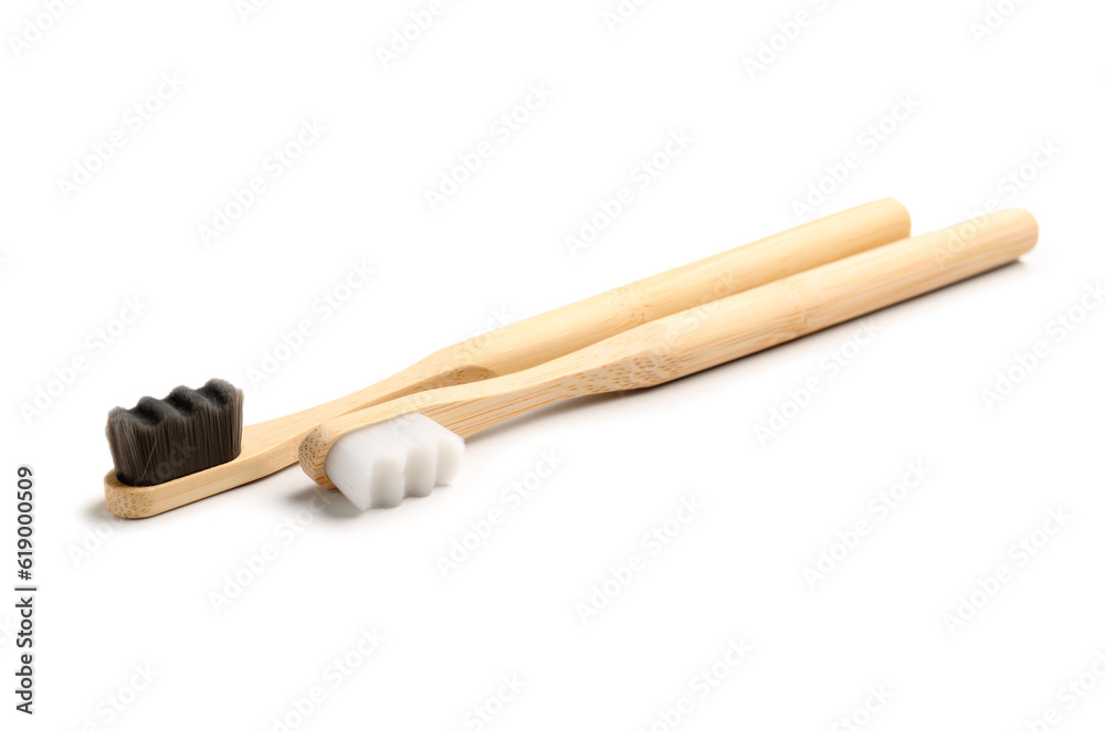 Bamboo tooth brushes on white background