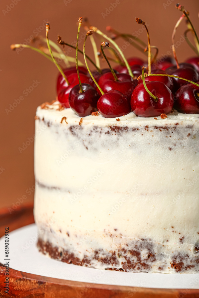 Tasty cherry cake on red background