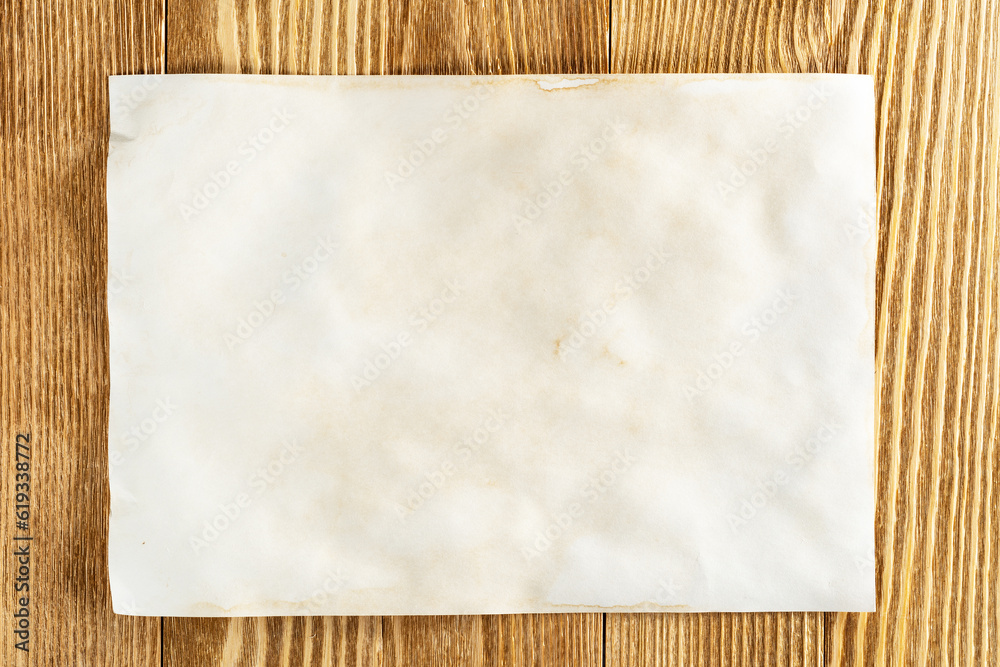 Sheet of paper lying on wooden table