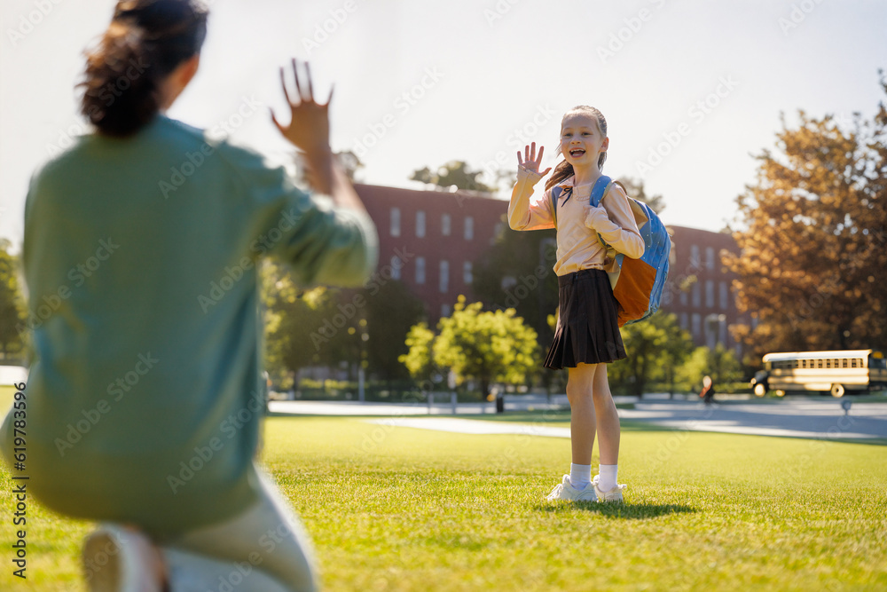 Parent and pupil going to school