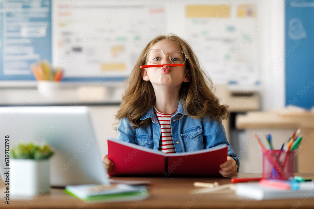 Girl doing homework or online education.