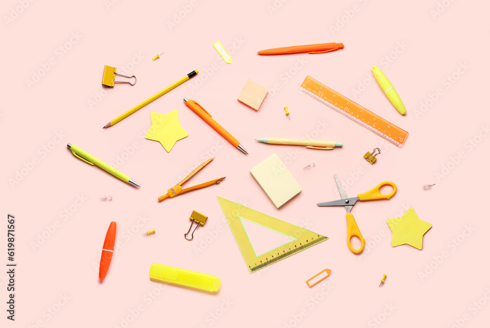 Composition with stationery supplies on pink background