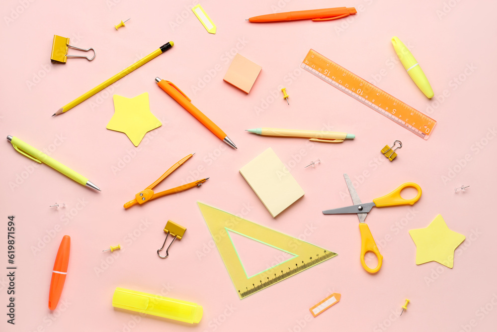 Composition with stationery supplies on pink background