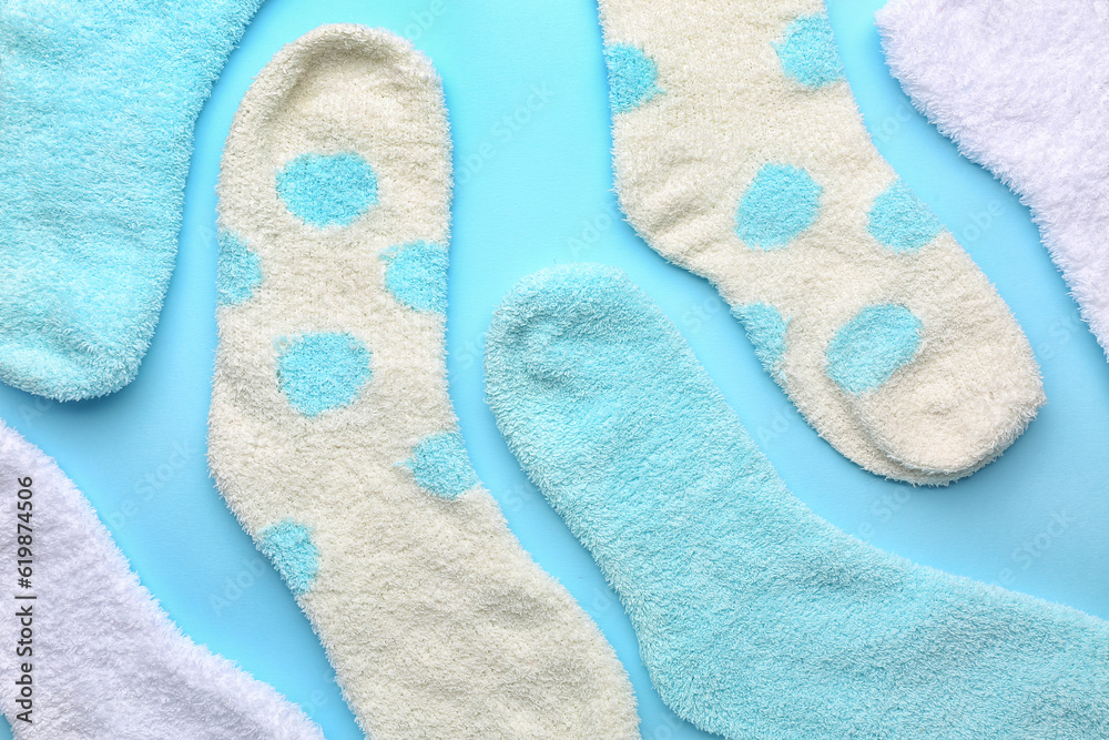 Set of warm socks on color background, closeup