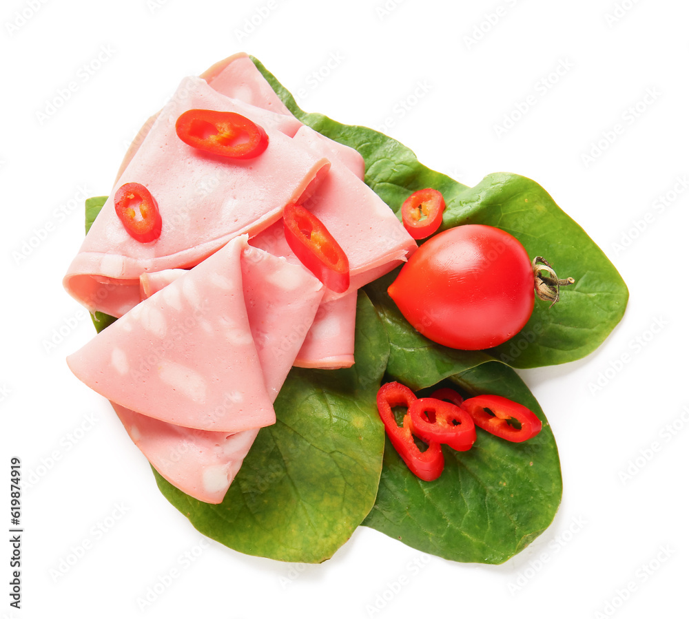 Slices of tasty boiled sausage with spinach and chilli on white background