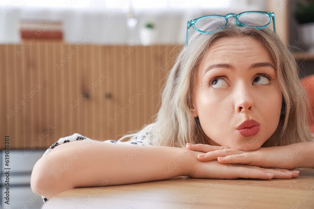 Young woman with stylish eyeglasses at home, closeup