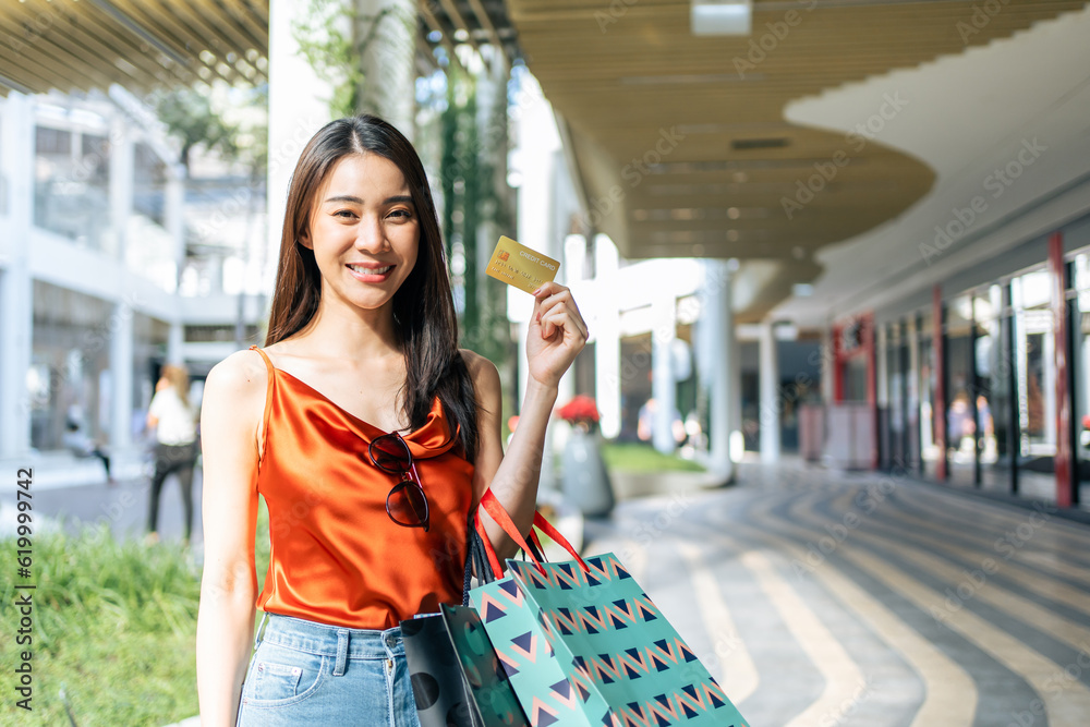 Portrait of Asian attractive girl shopping outdoor in department store. 