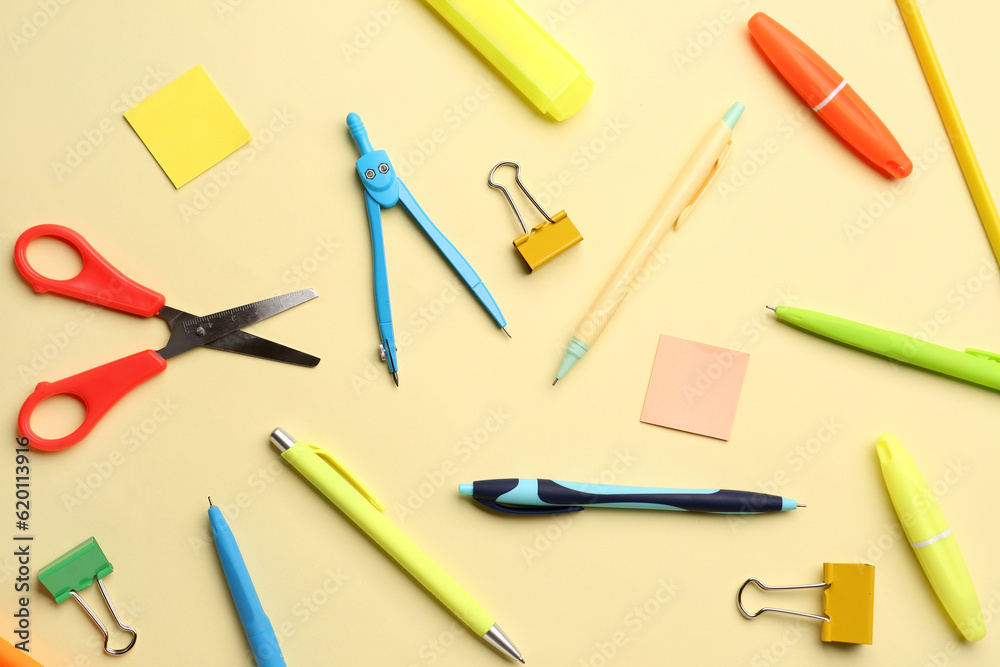 Composition with stationery supplies on yellow background