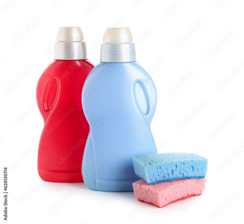 Bottles of detergent and sponges isolated on white background