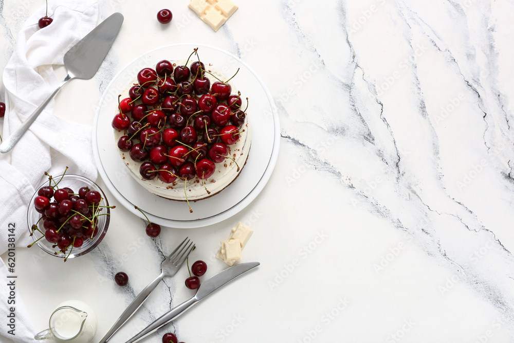 Plate with tasty cherry cake on white marble background