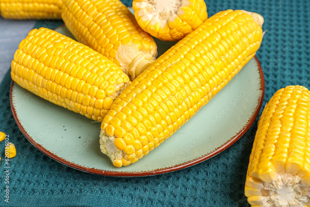 Plate with fresh corn cobs, closeup