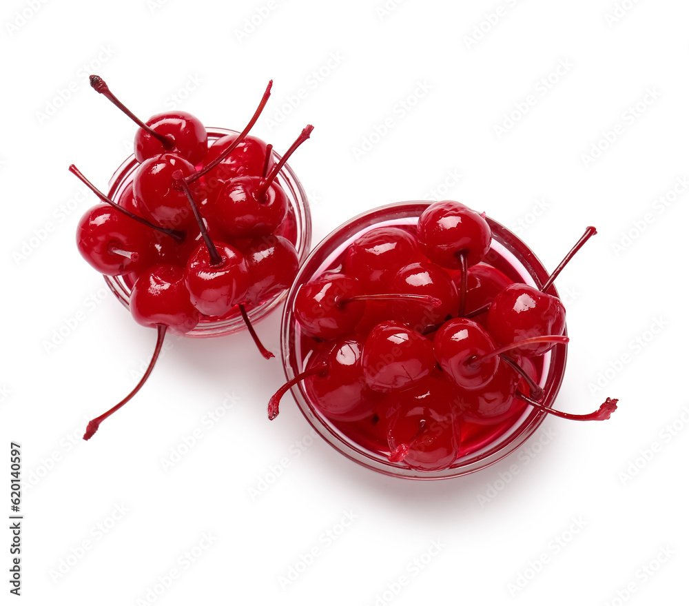 Bowls with tasty maraschino cherries on white background