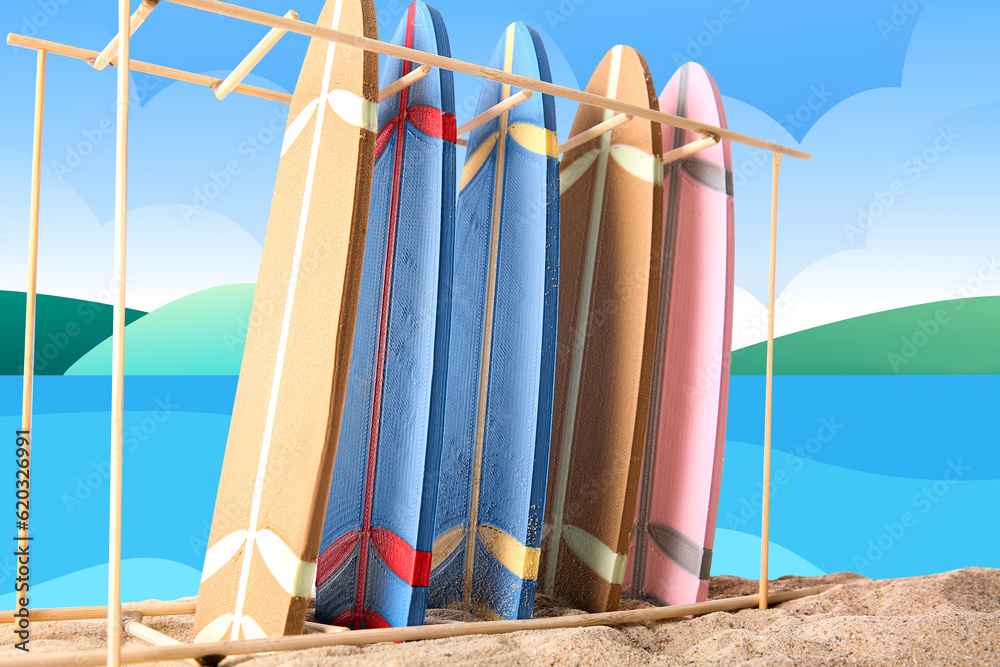 Stand with different surfboards on drawn sea beach