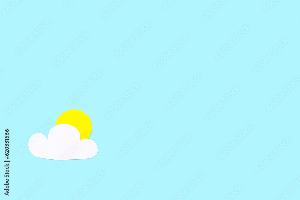 Paper sun with cloud on blue background. Weather forecast concept