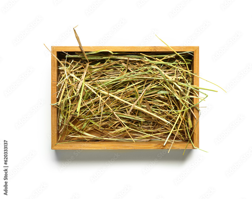 Straw in crate on white background