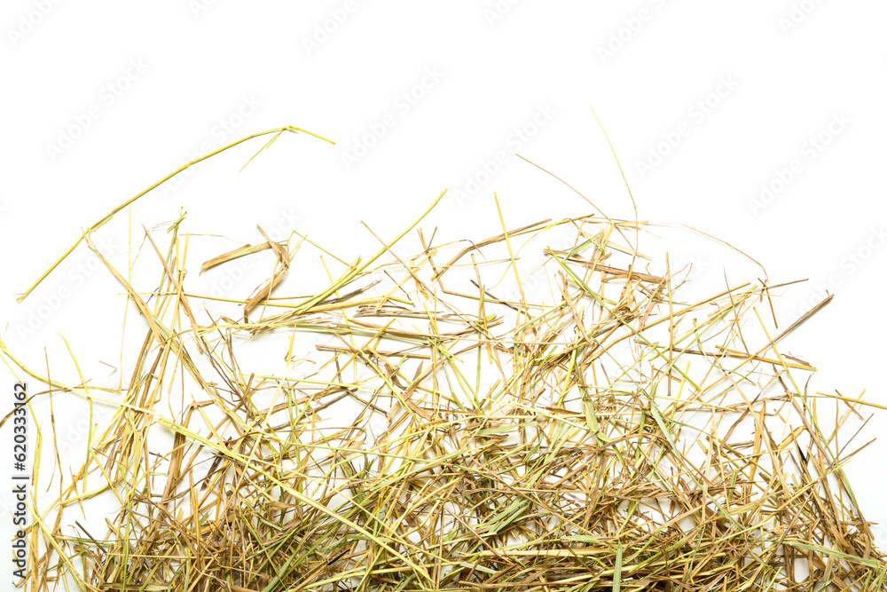 Straw scattered on white background