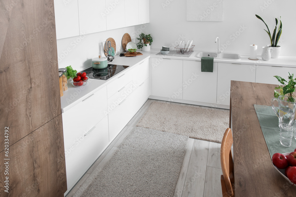 Soft rugs in interior of modern kitchen