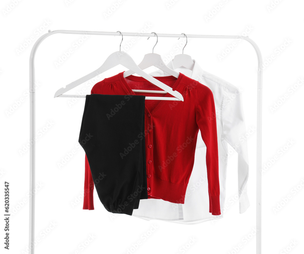 Rack with modern school uniform on white background