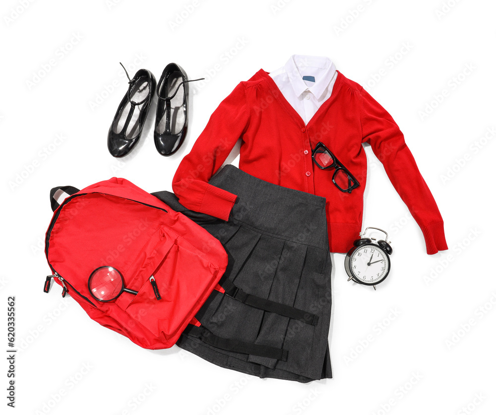 Composition with stylish school uniform, backpack, eyeglasses and alarm clock on white background