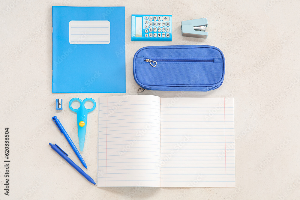 Notebooks with different stationery on white background