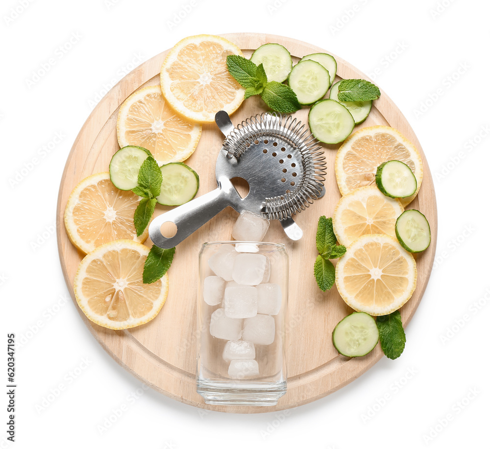 Strainer with mojito ingredients and glass of ice cubes on white background