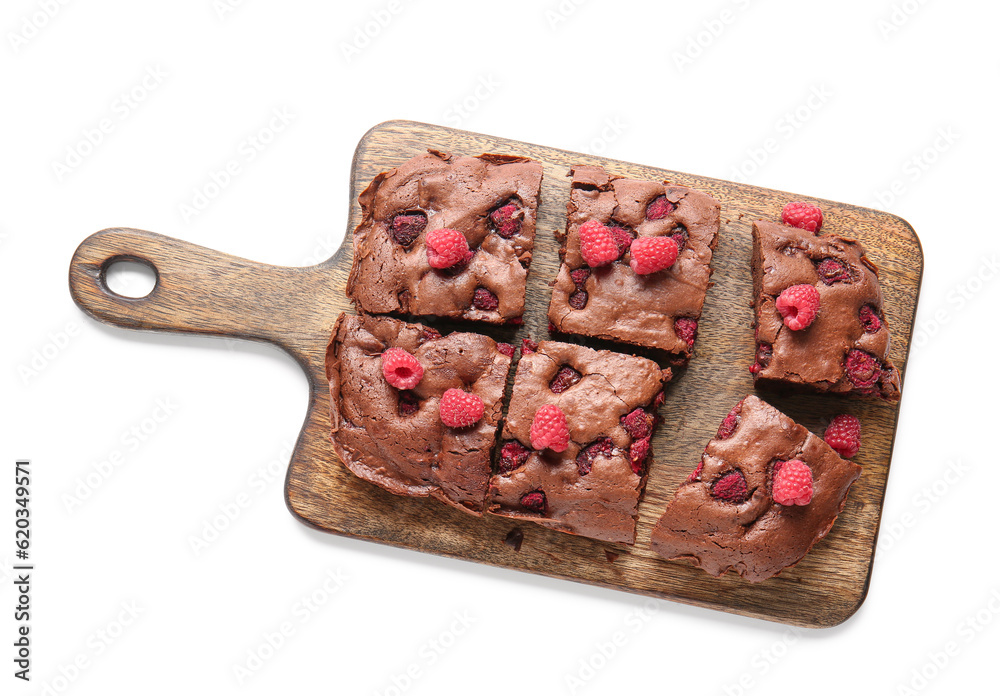 Wooden board with pieces of raspberry chocolate brownie on white background