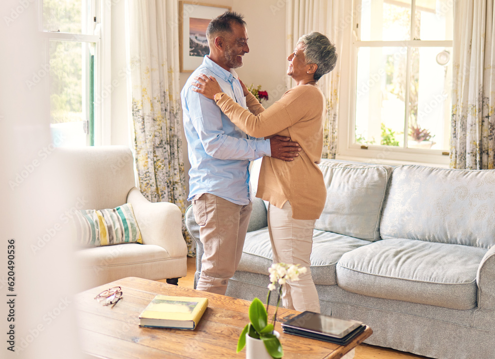 Love, romance and dance with a senior couple in the living room of their home together for bonding. 