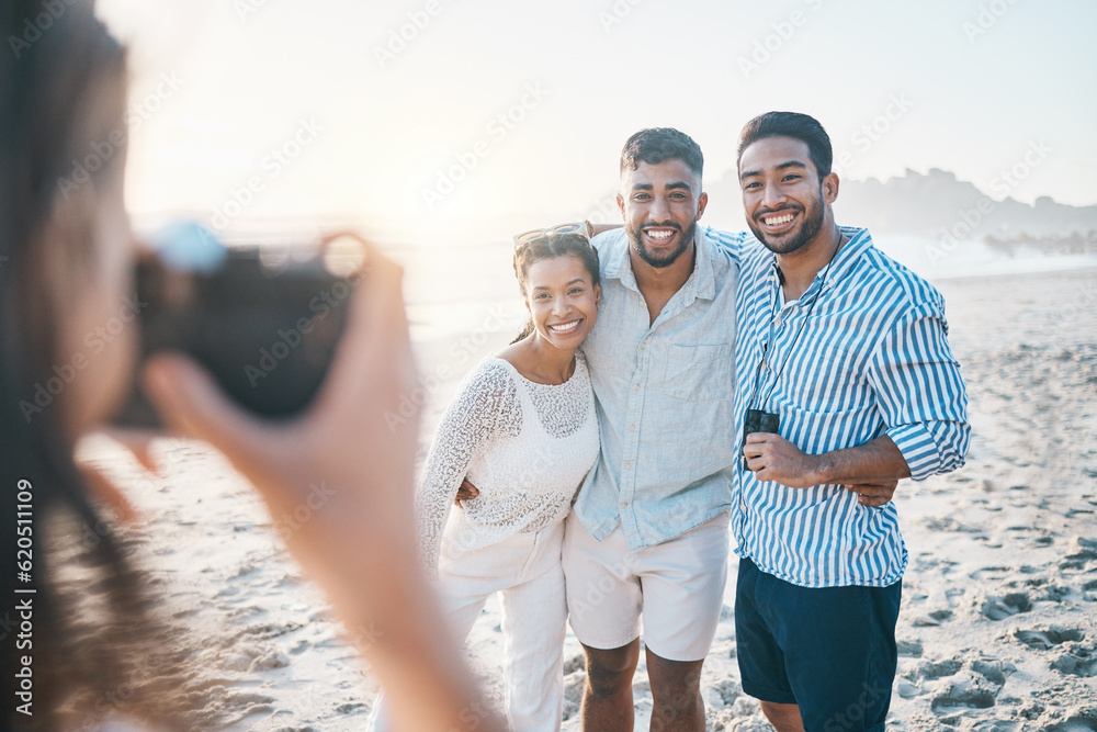 Happy, photo and friends at the beach with a photographer for summer memory, holiday or bonding. Smi