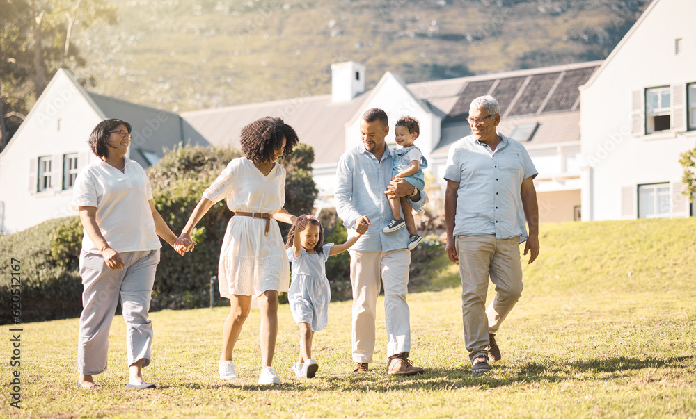 Holding hands, children and a blended family walking in the garden of their home together during sum