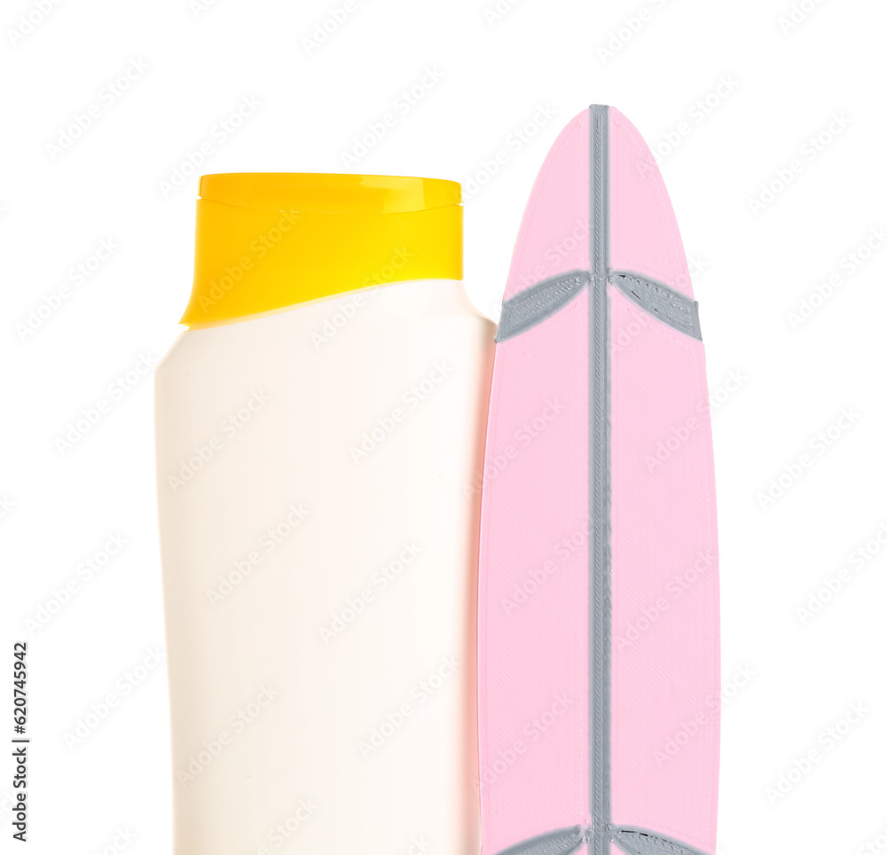 Mini surfboard with bottle of sunscreen cream isolated on white background